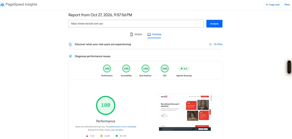 Laptop showing a PageSpeed report with four green circular scores
